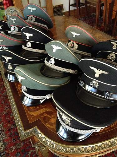 SS market in total rout:  black SS officer's cap sells for almost nothing in auction.