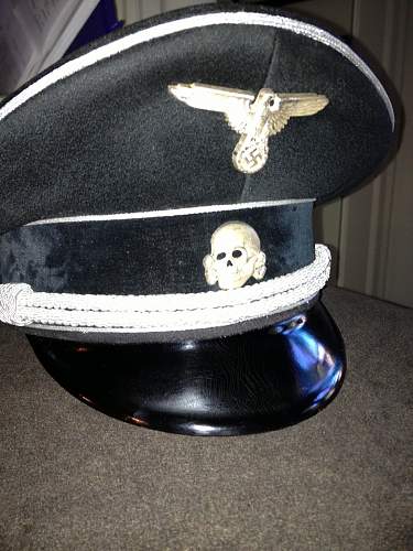 SS market in total rout:  black SS officer's cap sells for almost nothing in auction.