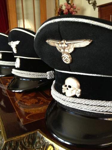 SS market in total rout:  black SS officer's cap sells for almost nothing in auction.