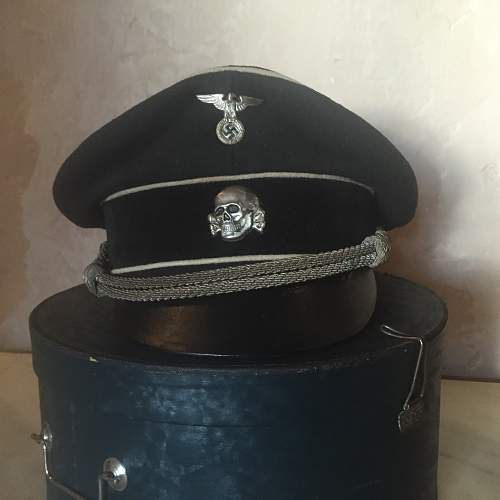 black SS officer caps, leather peaks