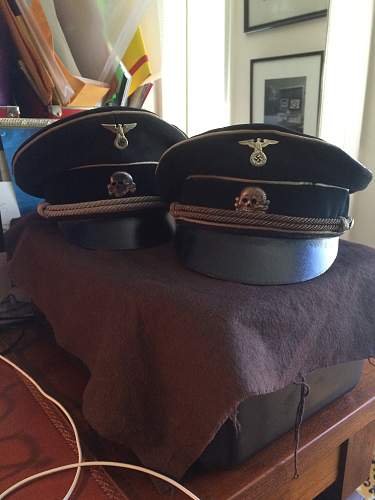 black SS officer caps, leather peaks