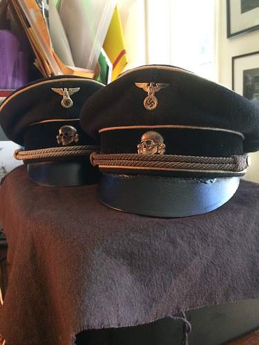 black SS officer caps, leather peaks