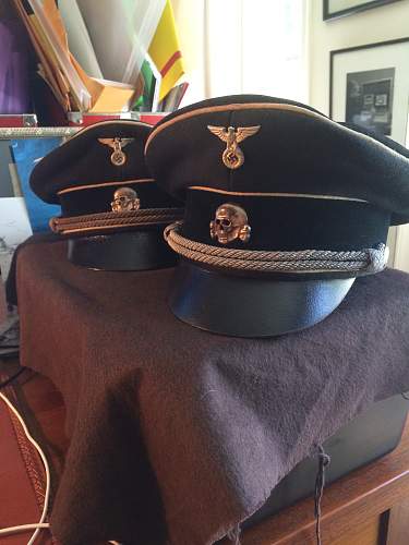 black SS officer caps, leather peaks