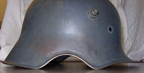 Value of  German M18 ear cut out helmets?