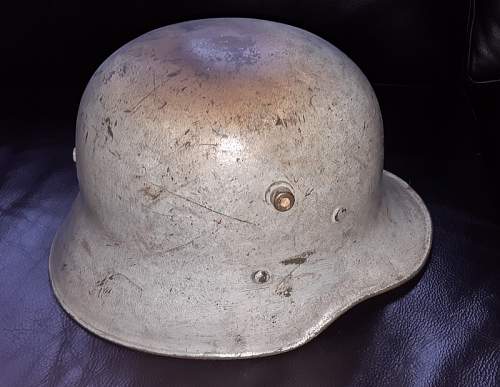 Stange stamped markings on top of helmet