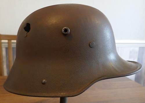 Battle damaged German M16 helmet