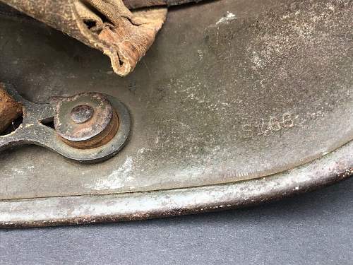 Battle damaged German M16 helmet