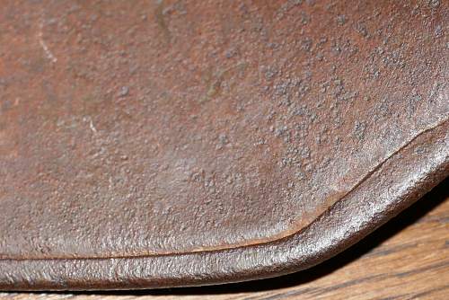 Battle damaged German M16 helmet