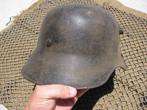 Value of  German M18 ear cut out helmets?