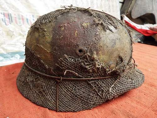 Battle damaged M40 wired camo helmet