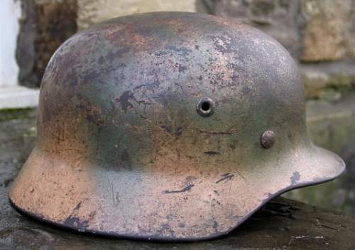 Ex DAK? Cammo M35 helmet.