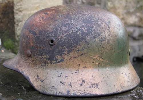 Ex DAK? Cammo M35 helmet.