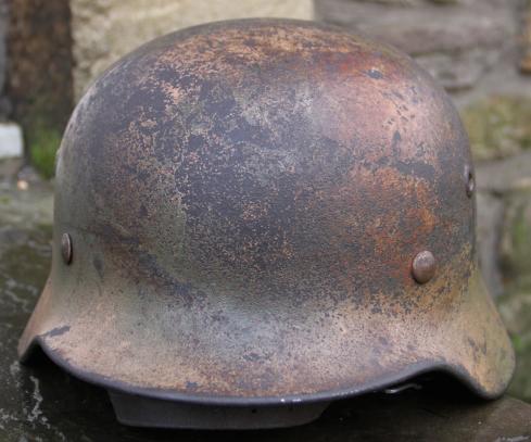 Ex DAK? Cammo M35 helmet.