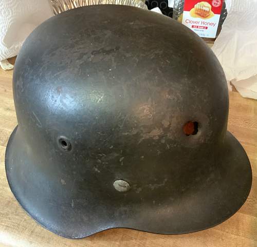 LW Helmet with apparent bullet/shrapnel hit