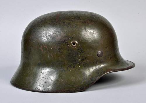 M40 German helmet. Potentially ex SS based on the party shield under the heer decal on the left side.