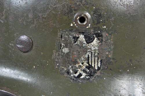 M40 German helmet. Potentially ex SS based on the party shield under the heer decal on the left side.