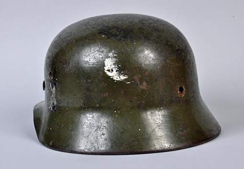 M40 German helmet. Potentially ex SS based on the party shield under the heer decal on the left side.