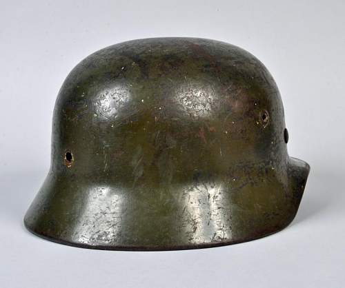 M40 German helmet. Potentially ex SS based on the party shield under the heer decal on the left side.