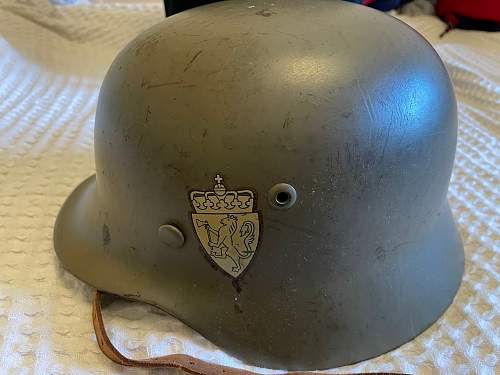 M40 German helmet. Potentially ex SS based on the party shield under the heer decal on the left side.