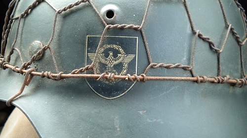 Police helmet with wire cover