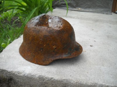 Battledamaged M35 helmet  from Kurland pocket