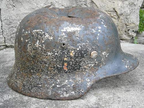 Battledamaged M35 helmet  from Kurland pocket