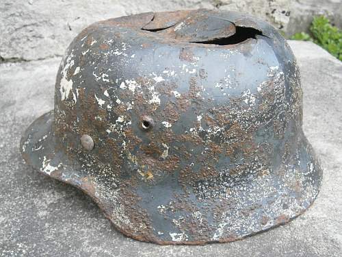 Battledamaged M35 helmet  from Kurland pocket