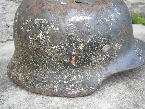 Battledamaged M35 helmet  from Kurland pocket