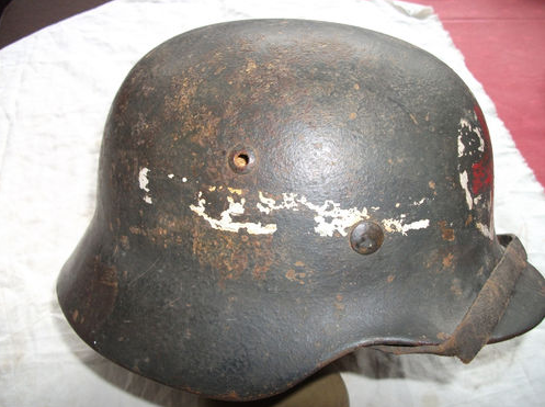 Is this a real WWII helmet, with red cross?