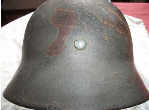 Is this a real WWII helmet, with red cross?