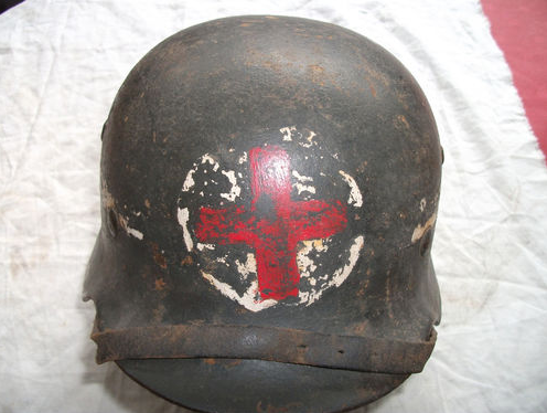 Is this a real WWII helmet, with red cross?