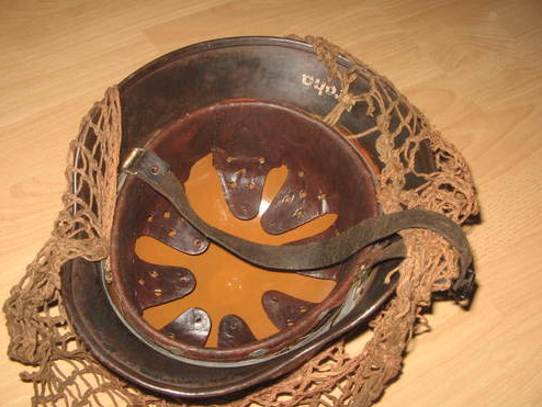 Is this a real WWII helmet, with red cross?