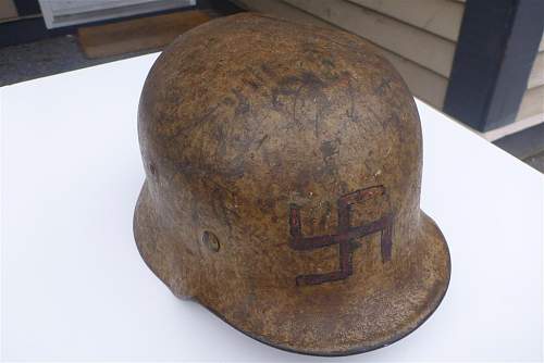 A (dirty) tan camo helmet