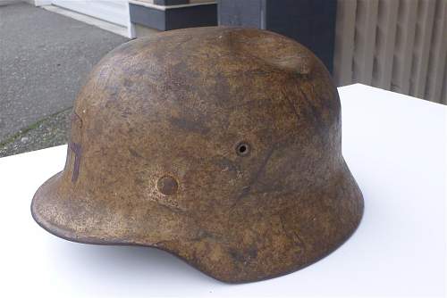 A (dirty) tan camo helmet