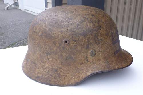 A (dirty) tan camo helmet