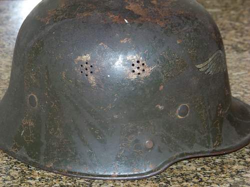 Dark green M34 luftschutz helmet.