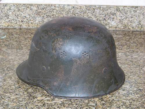 Dark green M34 luftschutz helmet.