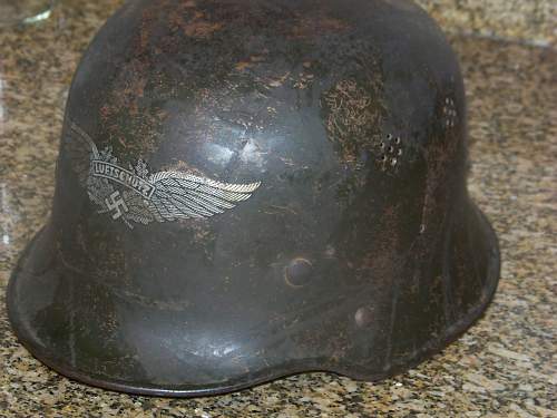 Dark green M34 luftschutz helmet.