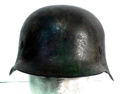 Is this helmet really an authentic post war painted Normandy camo scheme helmet?