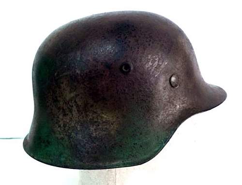 Is this helmet really an authentic post war painted Normandy camo scheme helmet?