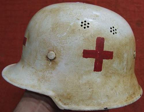 Is tis  original  german air raid home service helmet for the red cross