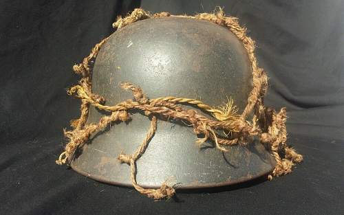 German helmet with camo netting..whats your thoughts