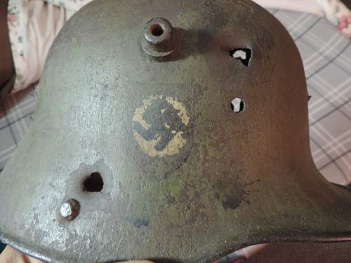 WW1 battle damaged German helmet with WW2 Nazi decals