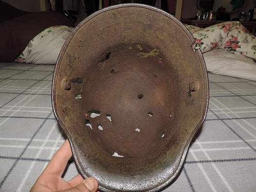 WW1 battle damaged German helmet with WW2 Nazi decals