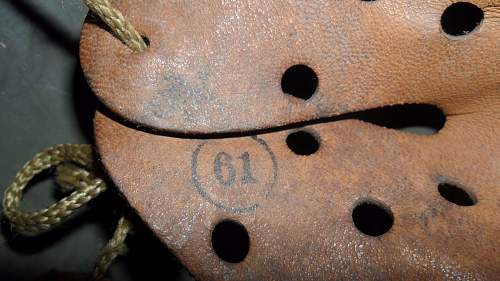 German m35  helmet on auction with camo band, need thoughts