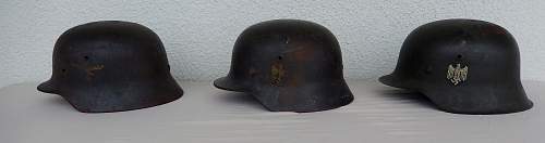 Three german helmets