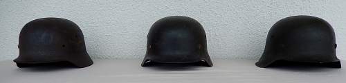 Three german helmets