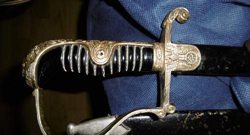 WH sword with left rotated svastika. Helps needed