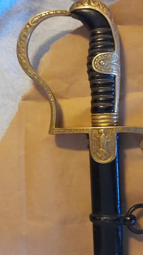 Need help identyfiyng sword before sale