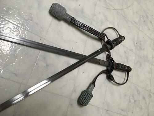 Left handed police swords?